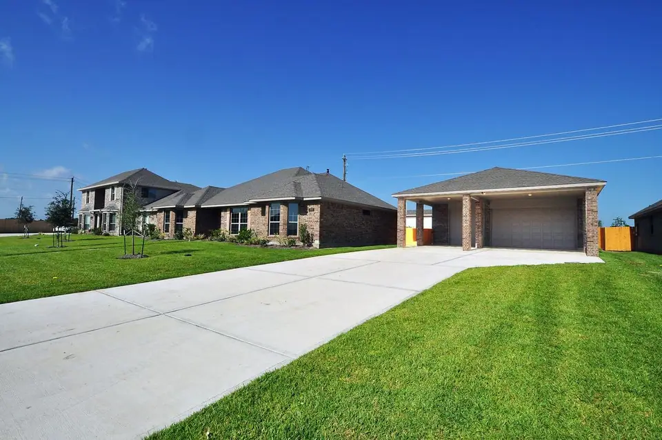 Driveway and garage beside the home at 3805 Verde River Road, League City, Texas