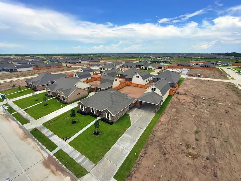 Aerial view of the home and neighboring construction at 2206 Fortuna Drive, League City, Texas