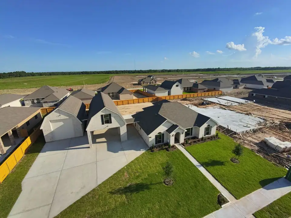 Aerial view of the driveway, garage and home at 2231 Ensenada Drive, League City, Texas