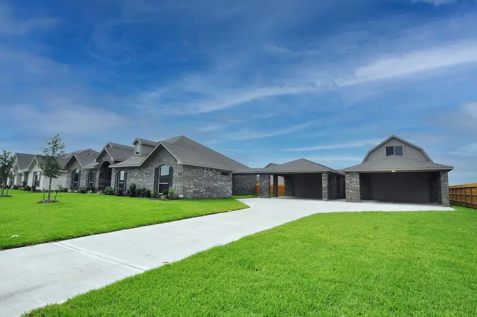 Wide driveway beside the home and garage at 2238 Ensenada Drive, League City, Texas