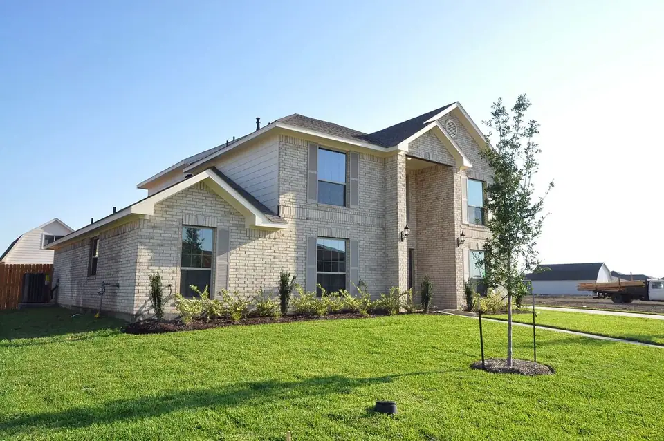 Angled exterior view of the two-story home at 2213 Ensenada Drive, League City, Texas