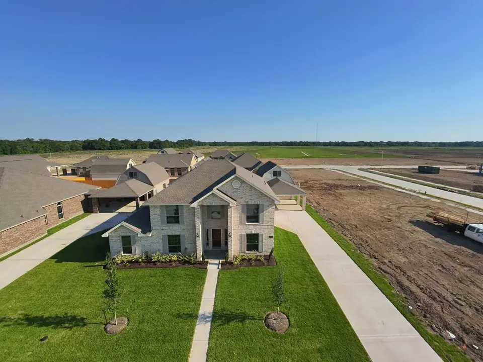 Aerial front view of the home and lawn at 2213 Ensenada Drive, League City, Texas
