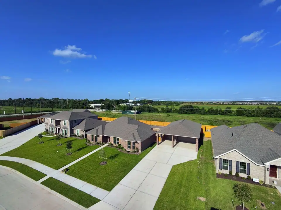 Aerial view of the home, garage and nearby homesites at 3805 Verde River Road, League City, Texas