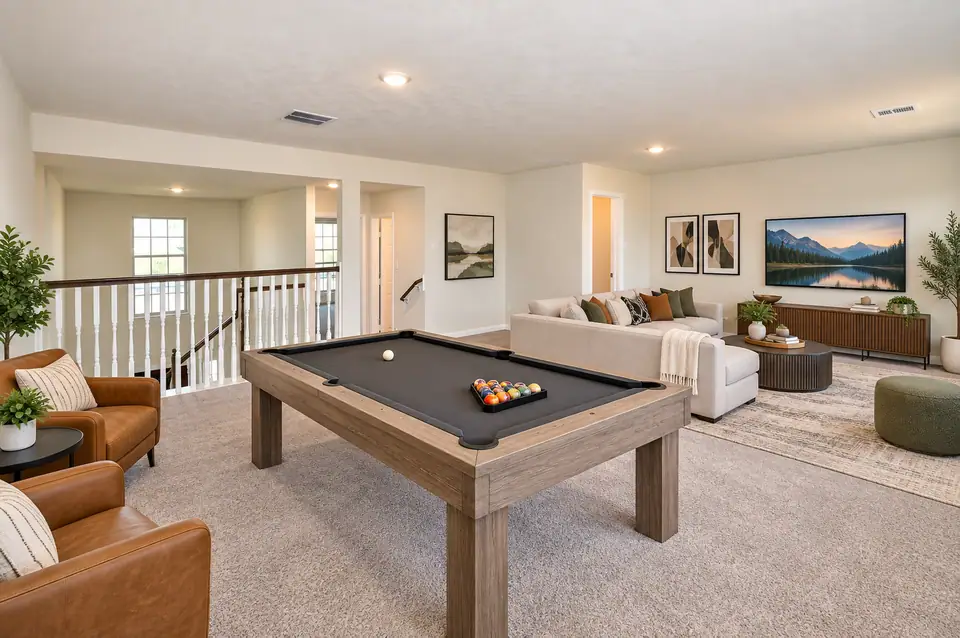 Game room with a pool table and lounge seating