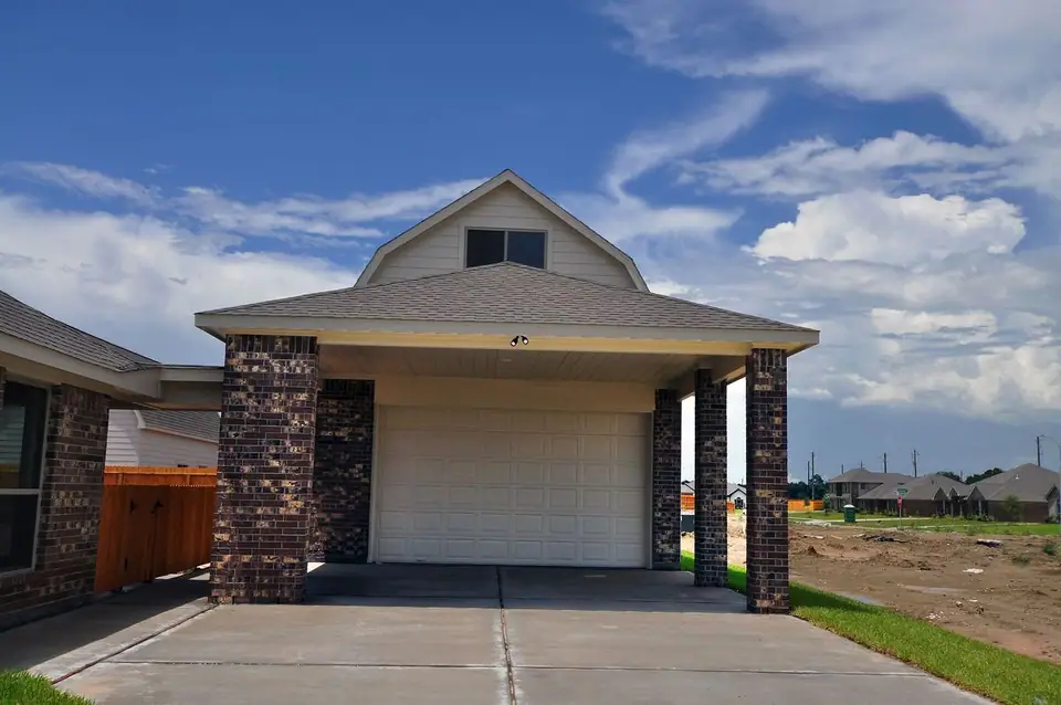 Garage exterior with a covered driveway at 2206 Fortuna Drive, League City, Texas