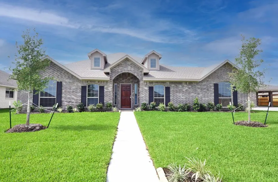 Brick front exterior with arched entrance at 2238 Ensenada Drive, League City, Texas