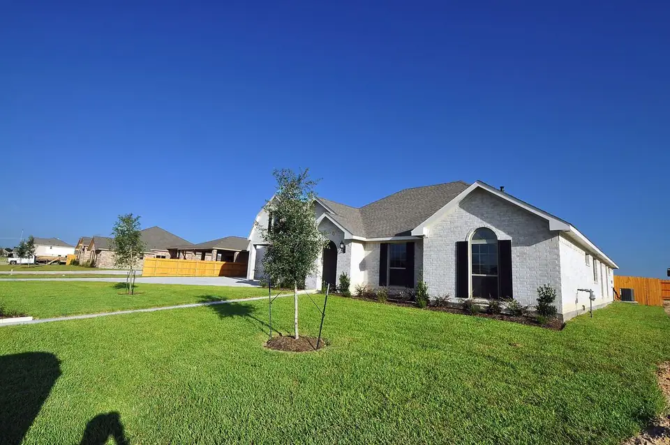 Angled front exterior and lawn at 2231 Ensenada Drive, League City, Texas