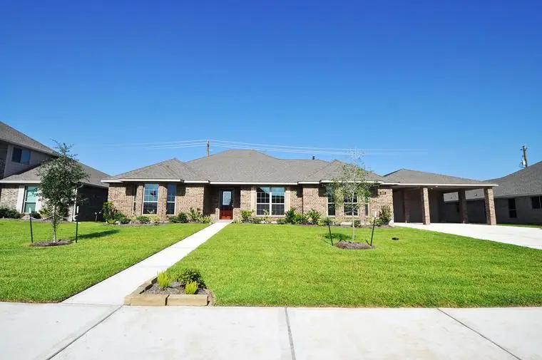Brick front exterior and wide lawn at 3805 Verde River Road, League City, Texas