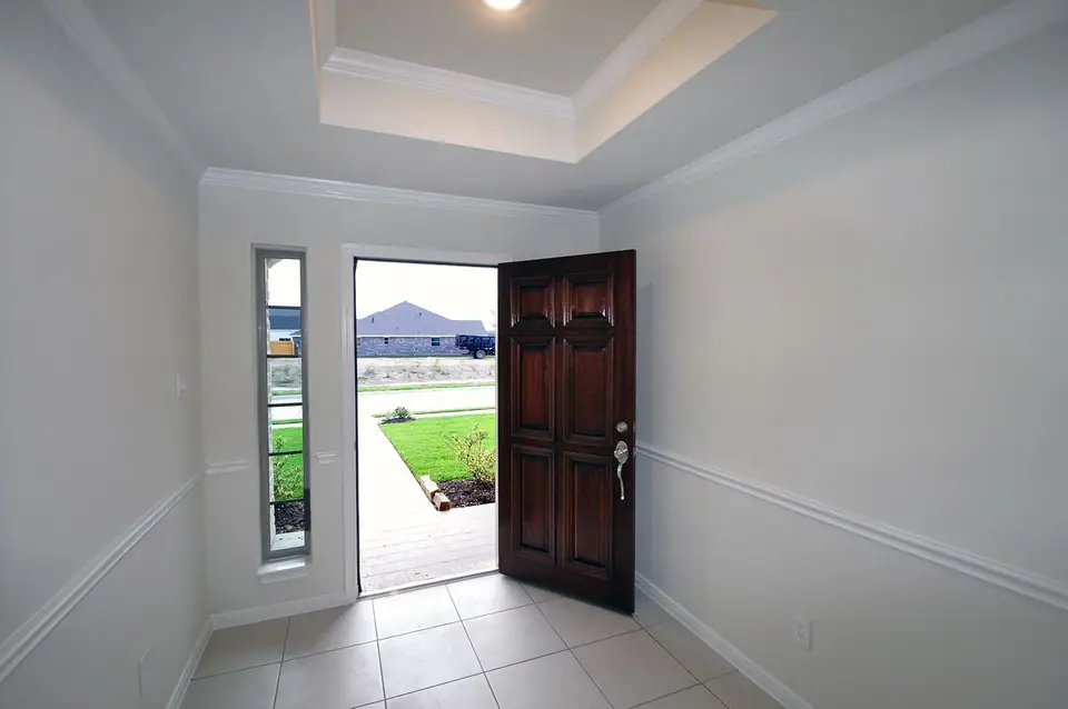 Entry foyer with an open front door at 3821 Verde River Road, League City, Texas
