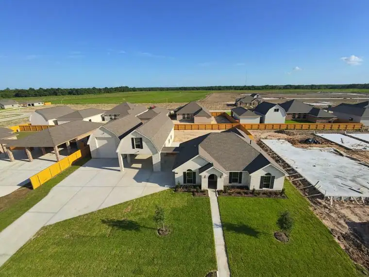 Aerial front view of the home and nearby construction at 2231 Ensenada Drive, League City, Texas