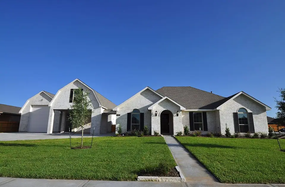Front exterior with an arched entrance at 2231 Ensenada Drive, League City, Texas