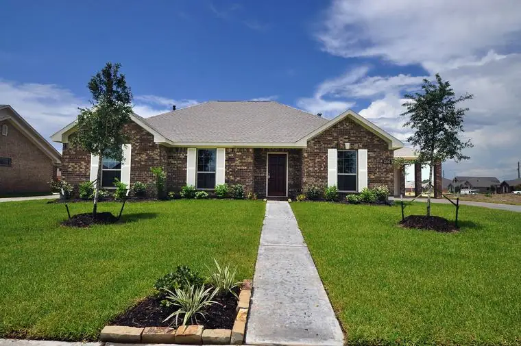 Brick front exterior with a landscaped lawn and front walkway at 2206 Fortuna Drive, League City, Texas