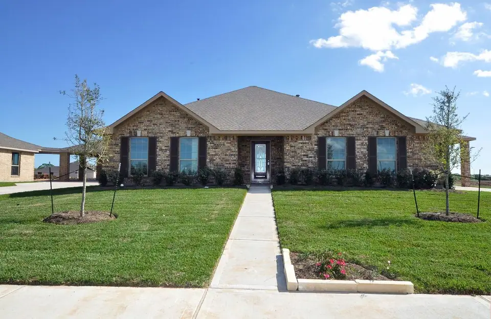 Brick front exterior and landscaped walkway at 2207 Dorado Street, League City, Texas